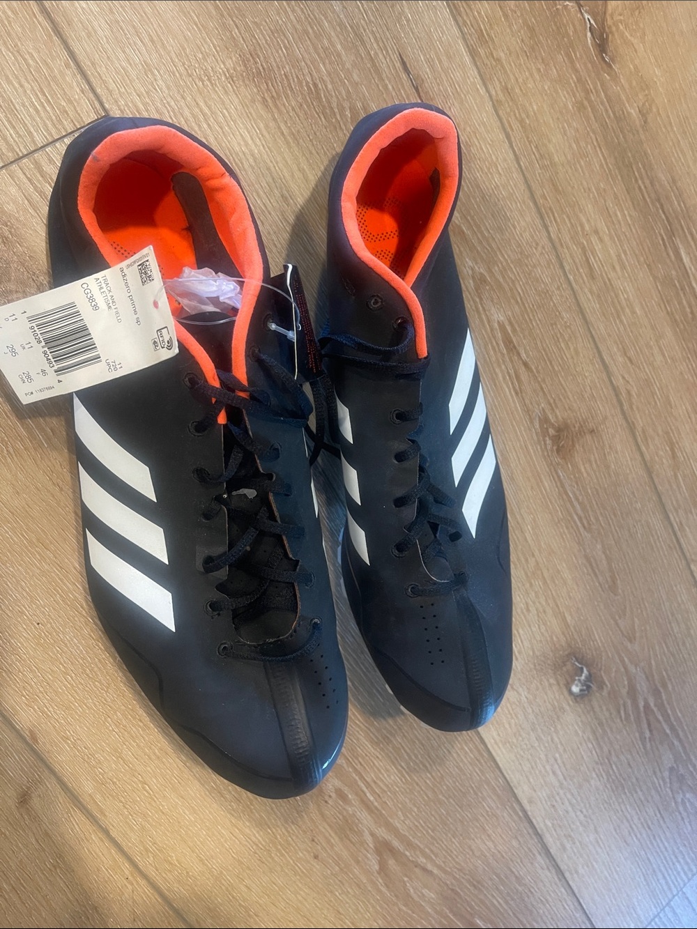 adidas Men’s Black Athletic Shoes with White Stripes and Orange Interior
